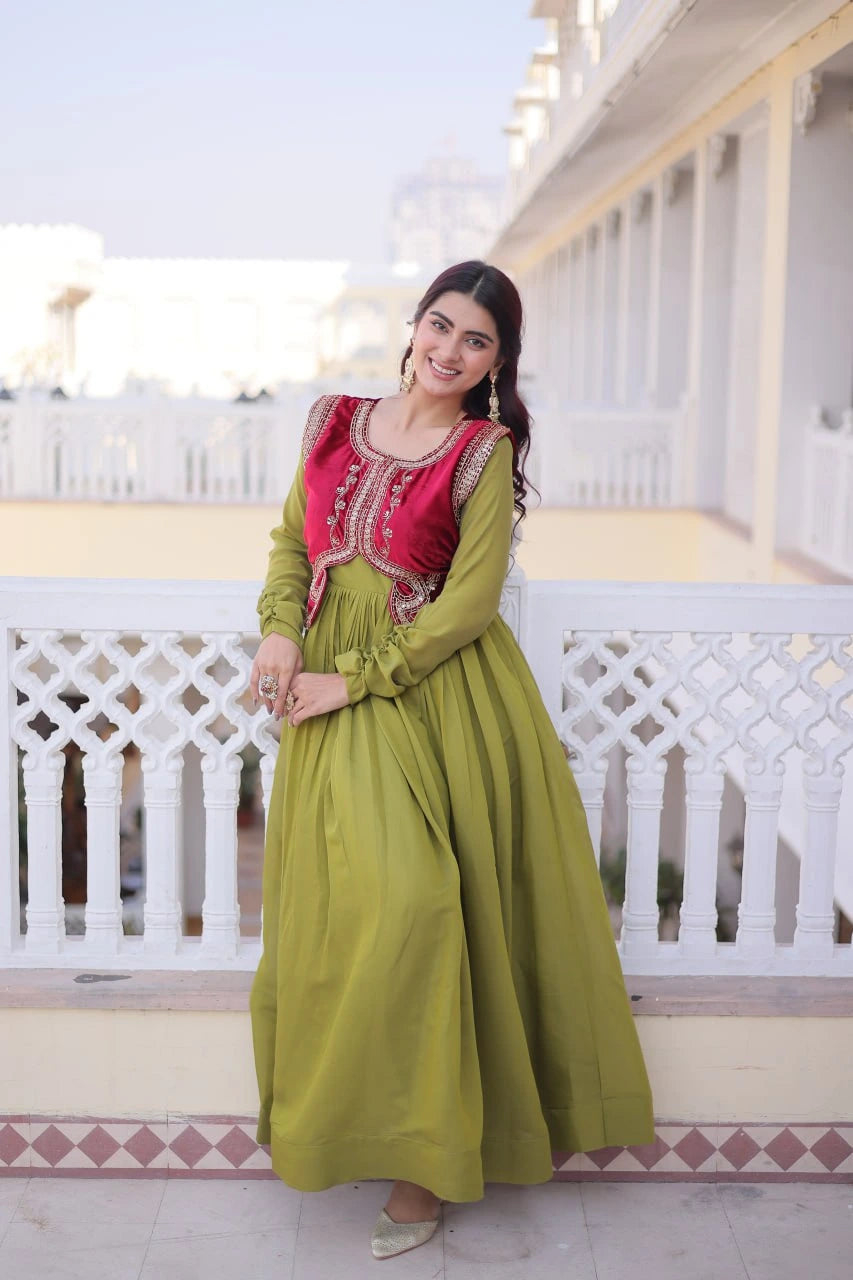 Woman in a green and red traditional outfit standing on a balcony.
