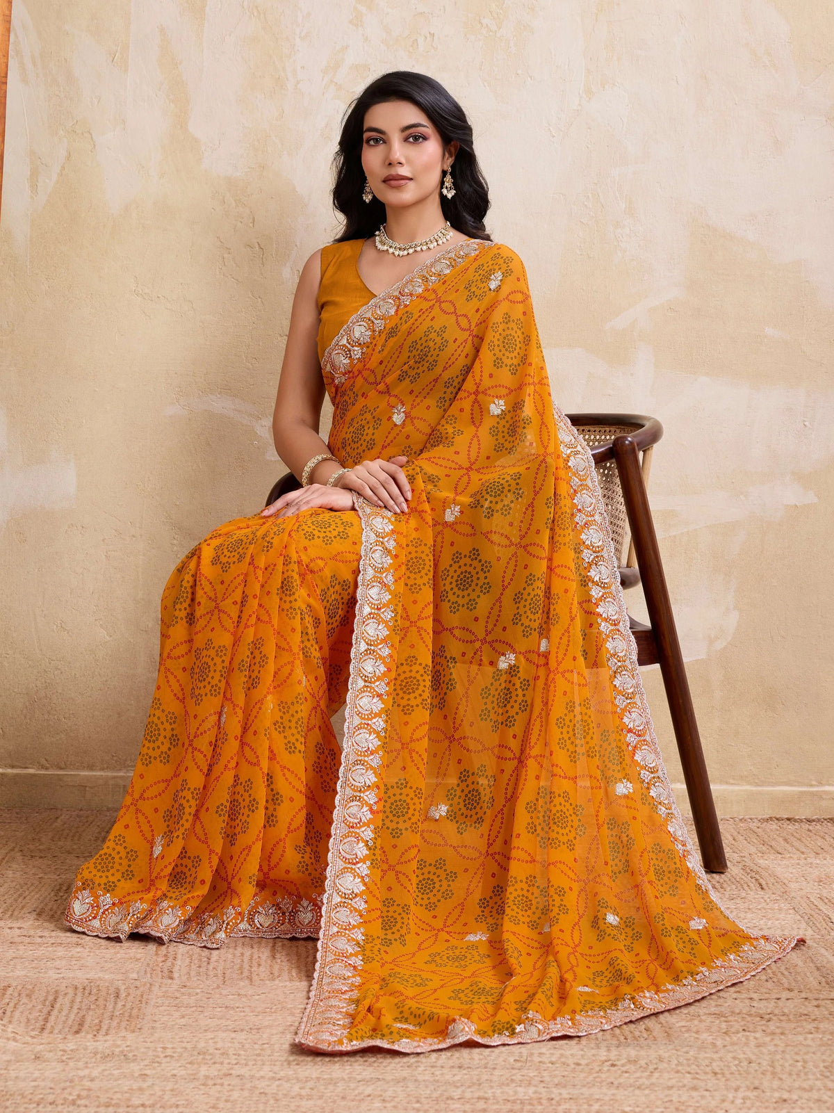 yellow georgette bandhej print saree