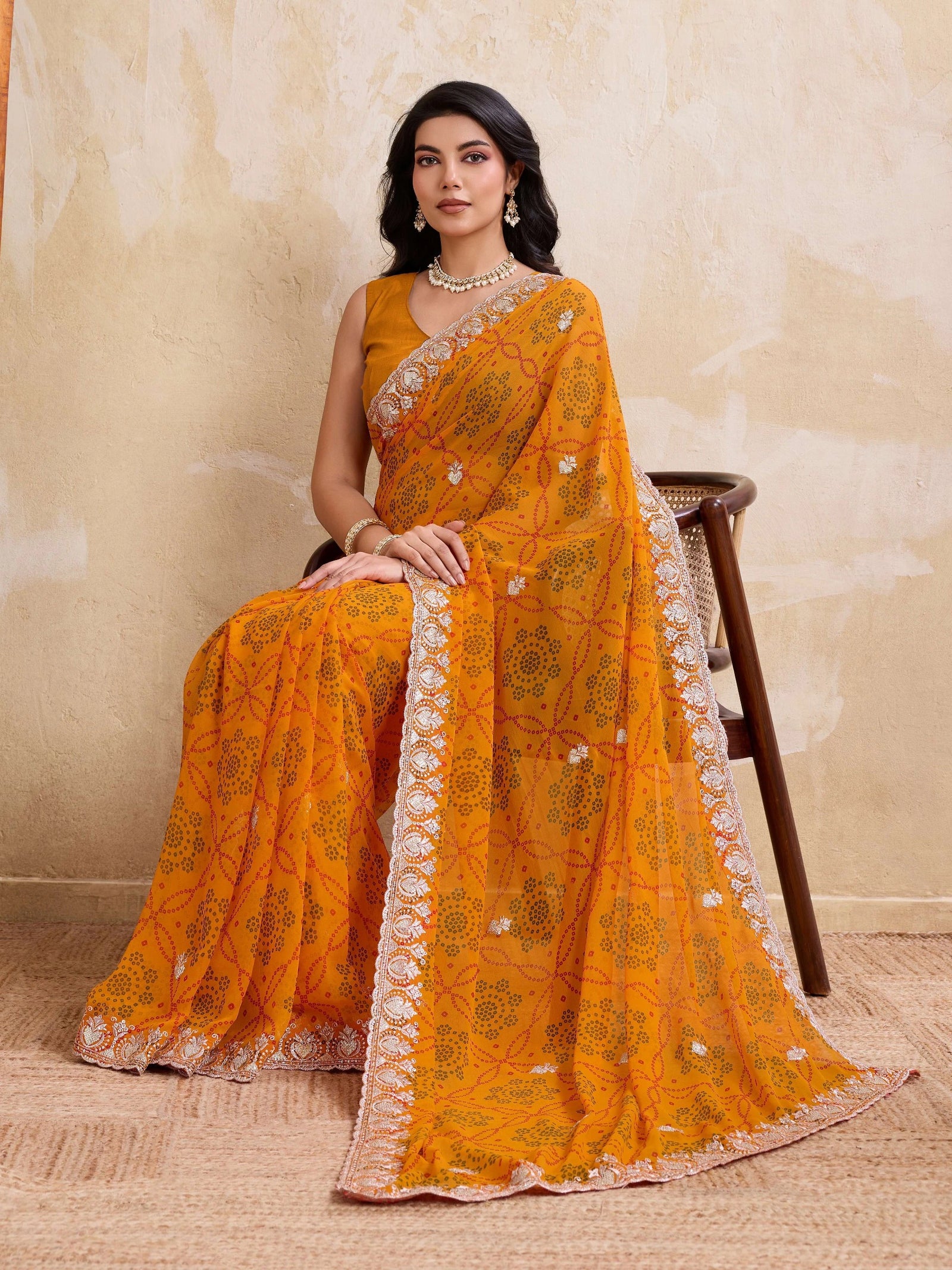 yellow georgette bandhej print saree