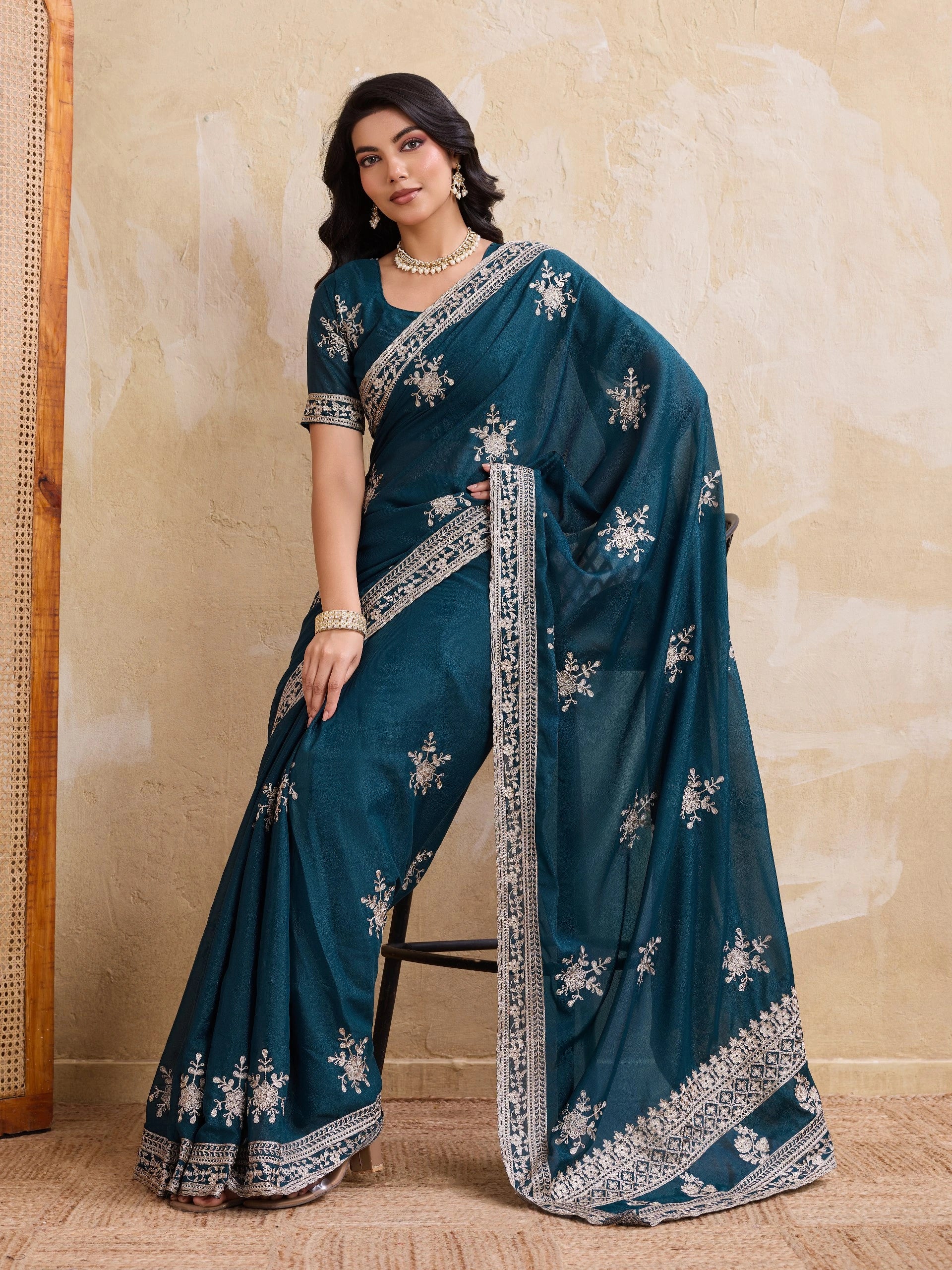 dark turquoise chainstitch embroidered star georgette saree