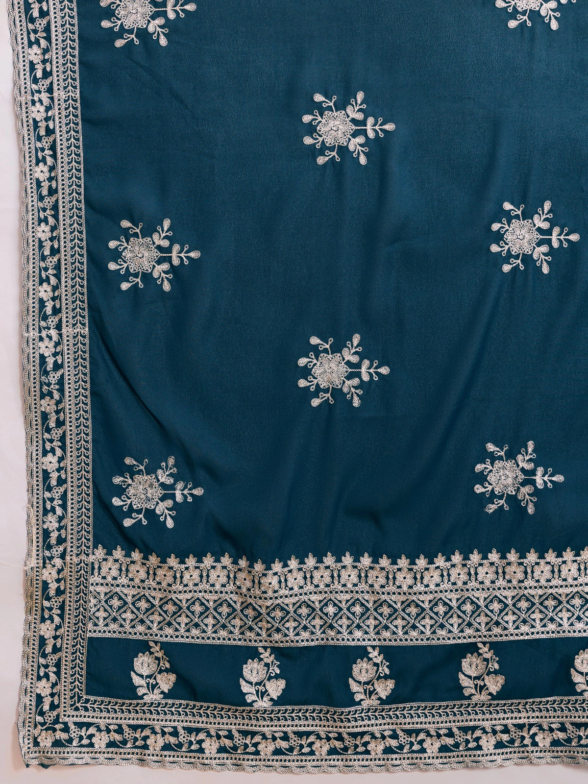 dark turquoise chainstitch embroidered star georgette saree