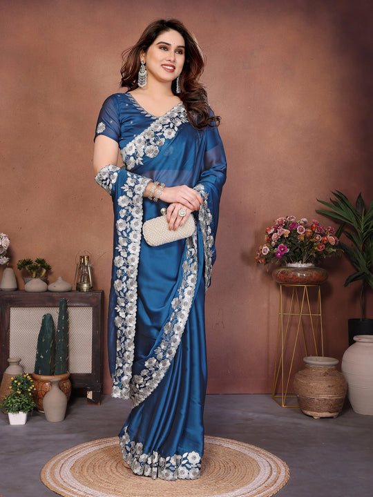blue silk saree featuring heavy embroidered floral borders
