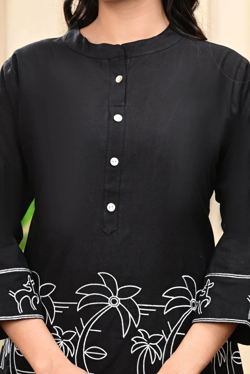 Black kurta with white floral embroidery on a neutral background