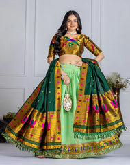 Woman wearing a traditional green and gold saree with a white background