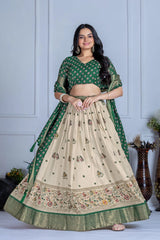 Woman wearing a green and beige traditional outfit with a white background