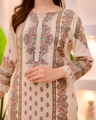 Beige embroidered traditional outfit with intricate patterns