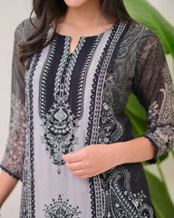 Embroidered traditional outfit with intricate patterns on a neutral background