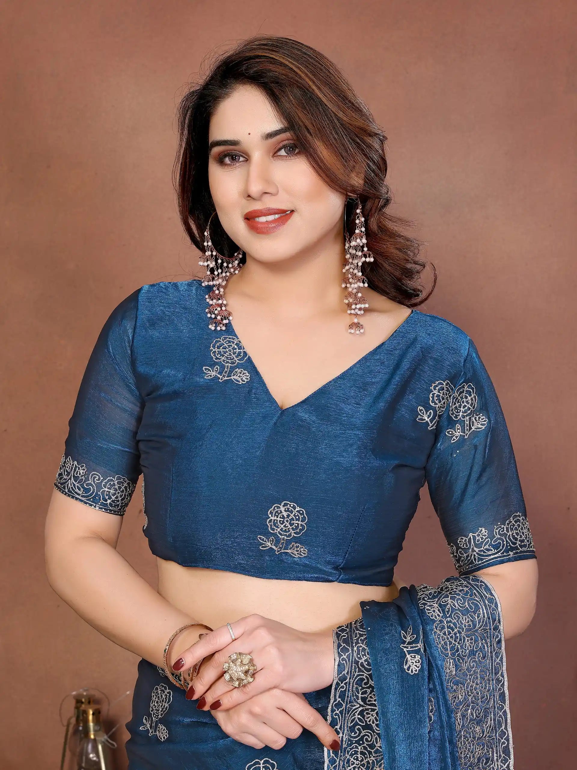 teal blue embroidered chiffon saree and blouse