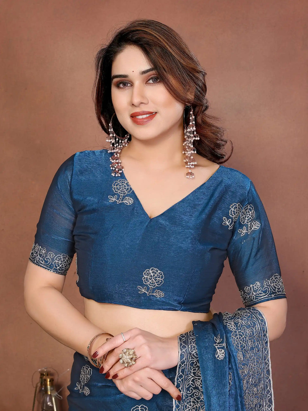 teal blue embroidered chiffon saree and blouse