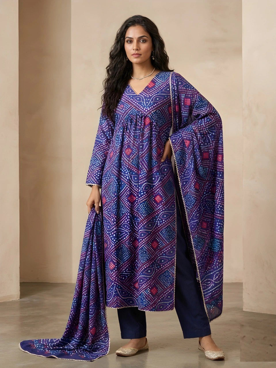 Woman wearing a blue patterned dress with a plain background