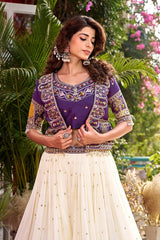 Woman wearing a purple and white traditional outfit with floral background