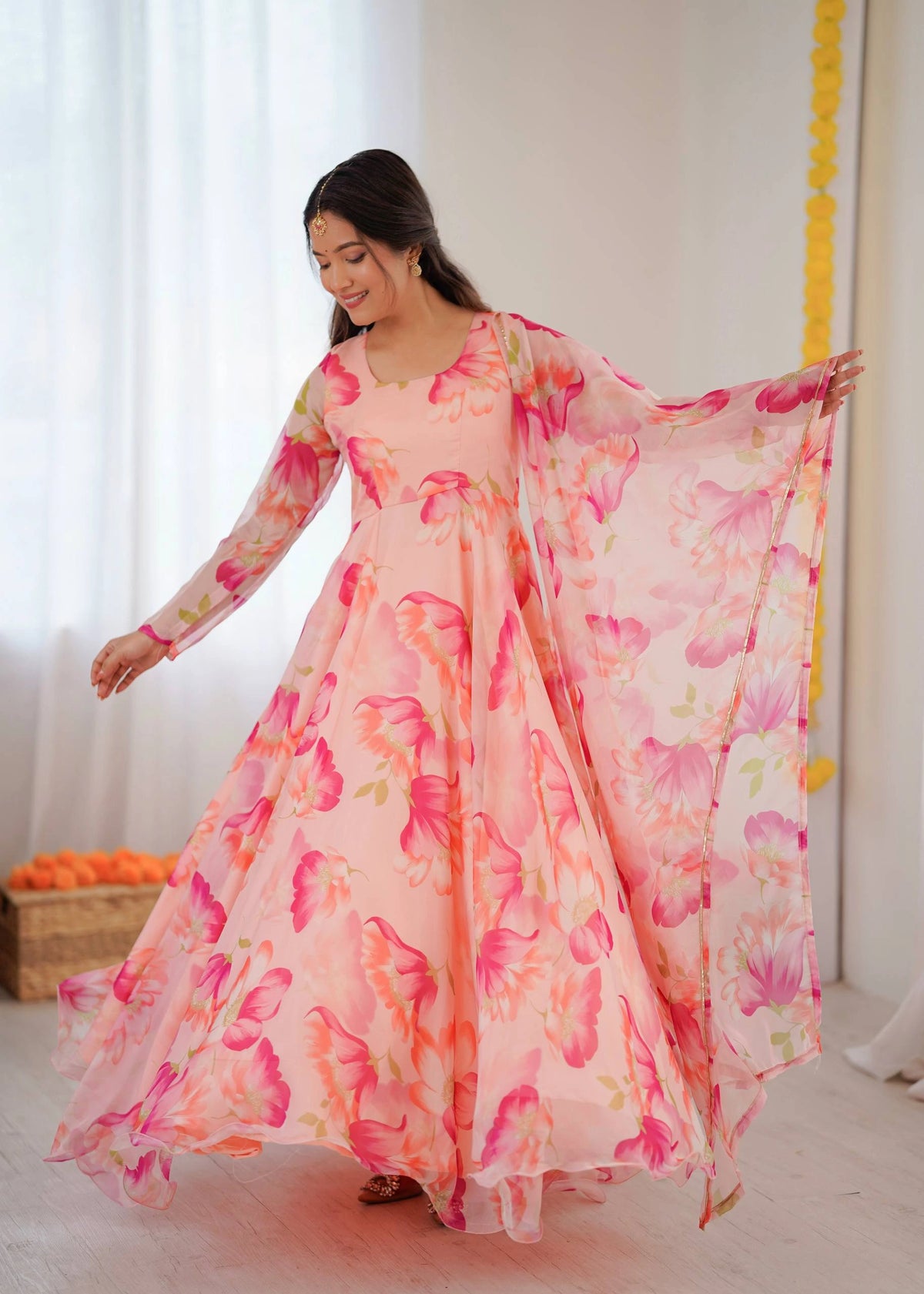 Woman wearing a floral dress with a white background