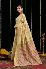 yellow soft spun cotton saree with a silver zari border