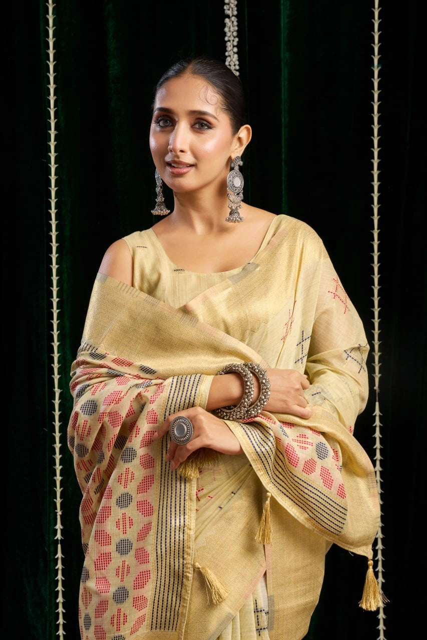 yellow soft spun cotton saree with a silver zari border