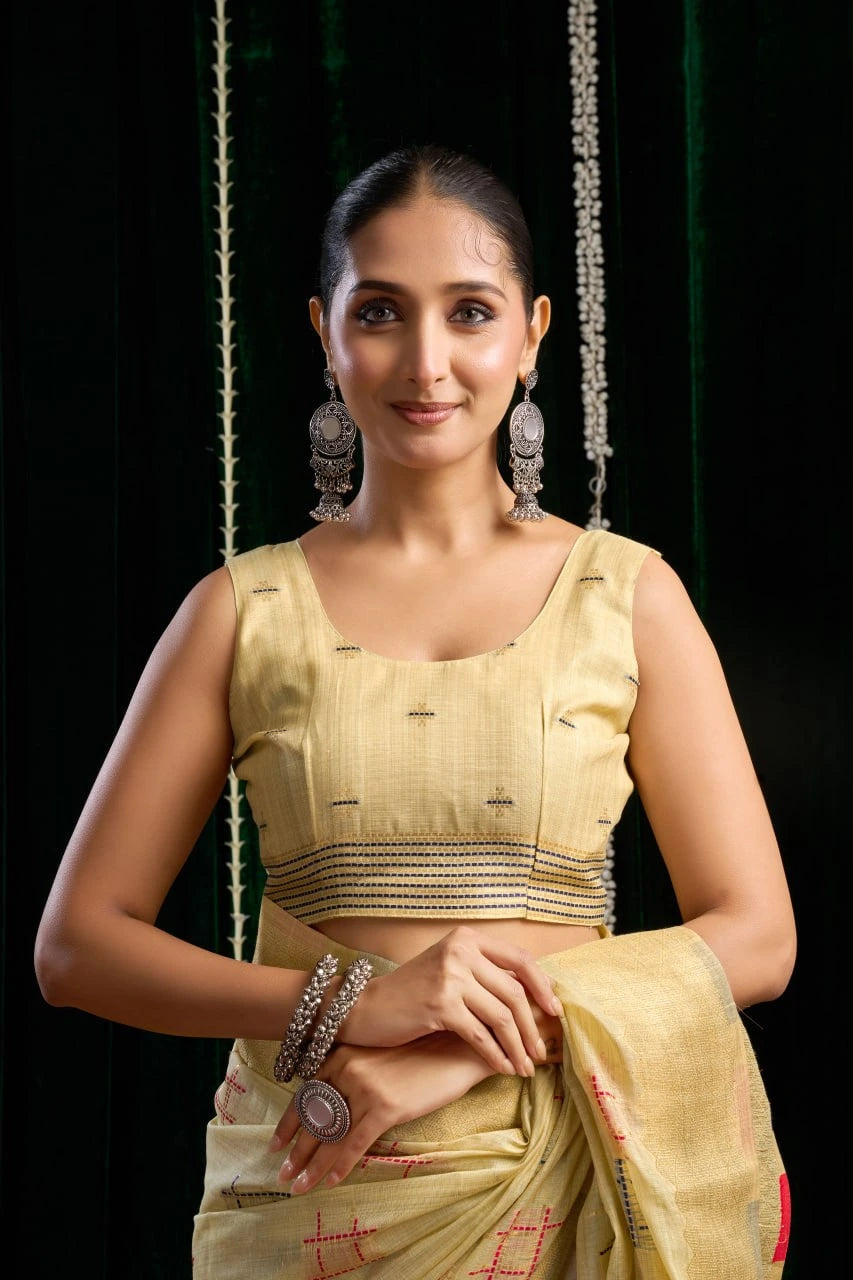 yellow soft spun cotton saree with a silver zari border