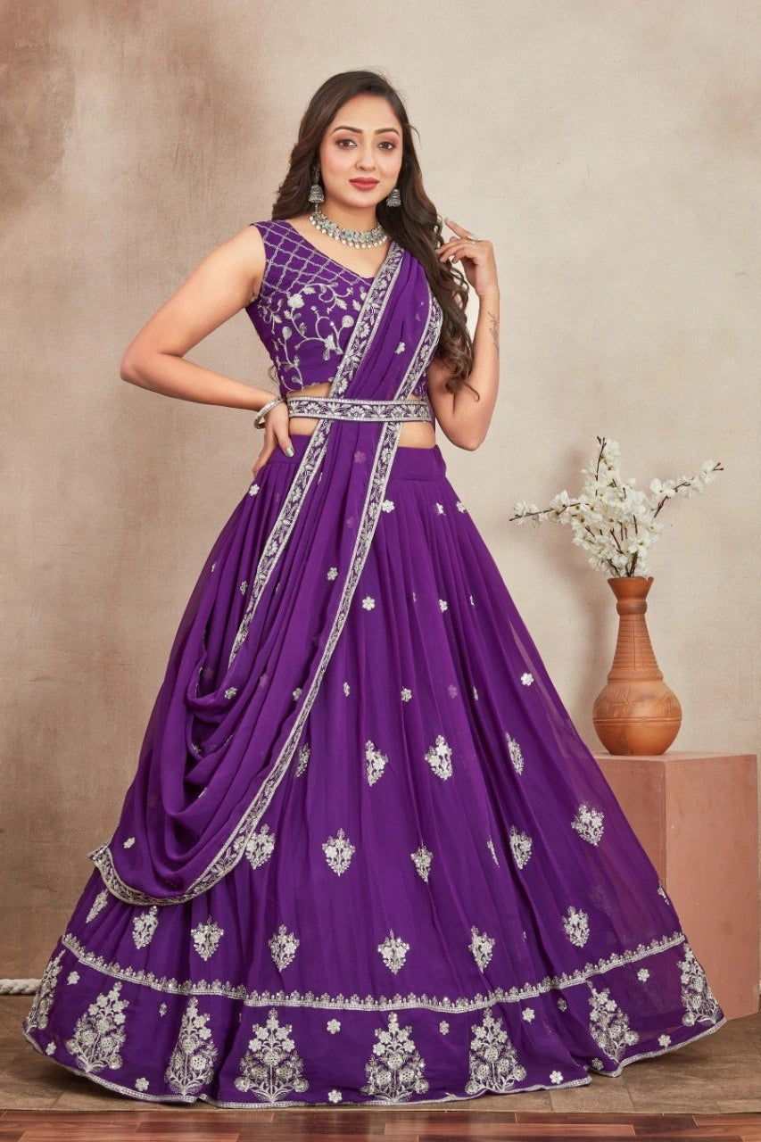 Woman wearing a purple embroidered traditional outfit with a plain background