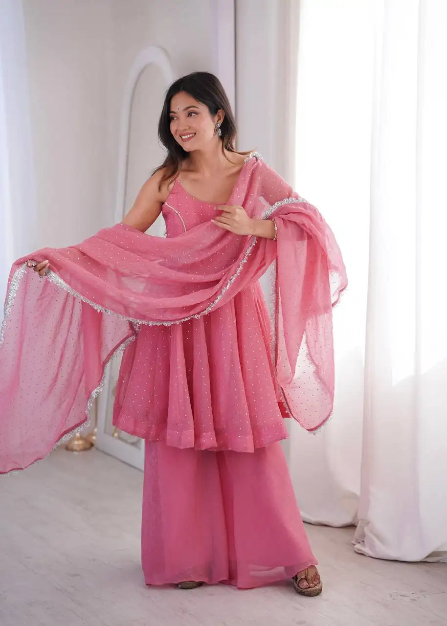 Pink Jharkhand Work Suit KU257 model holding dupatta lace border