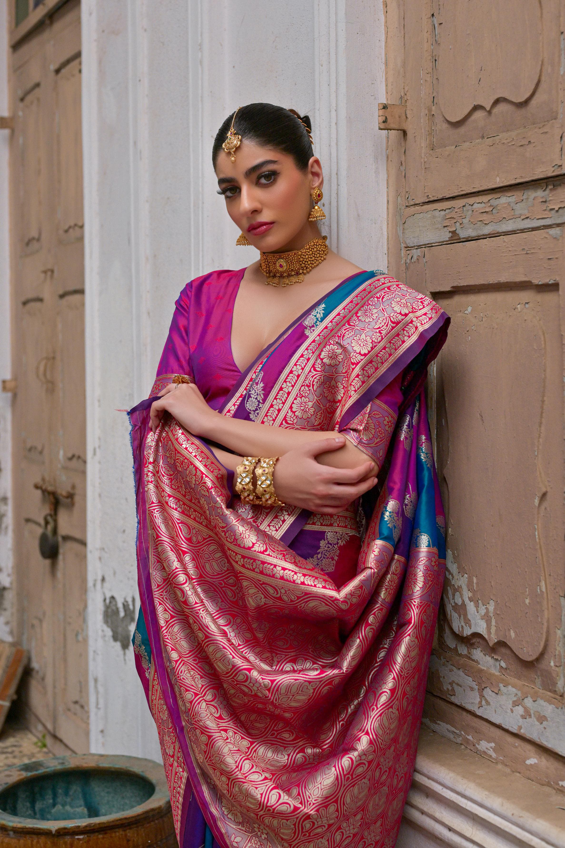 Close up of pink saree with intricate Kadwa style weaving