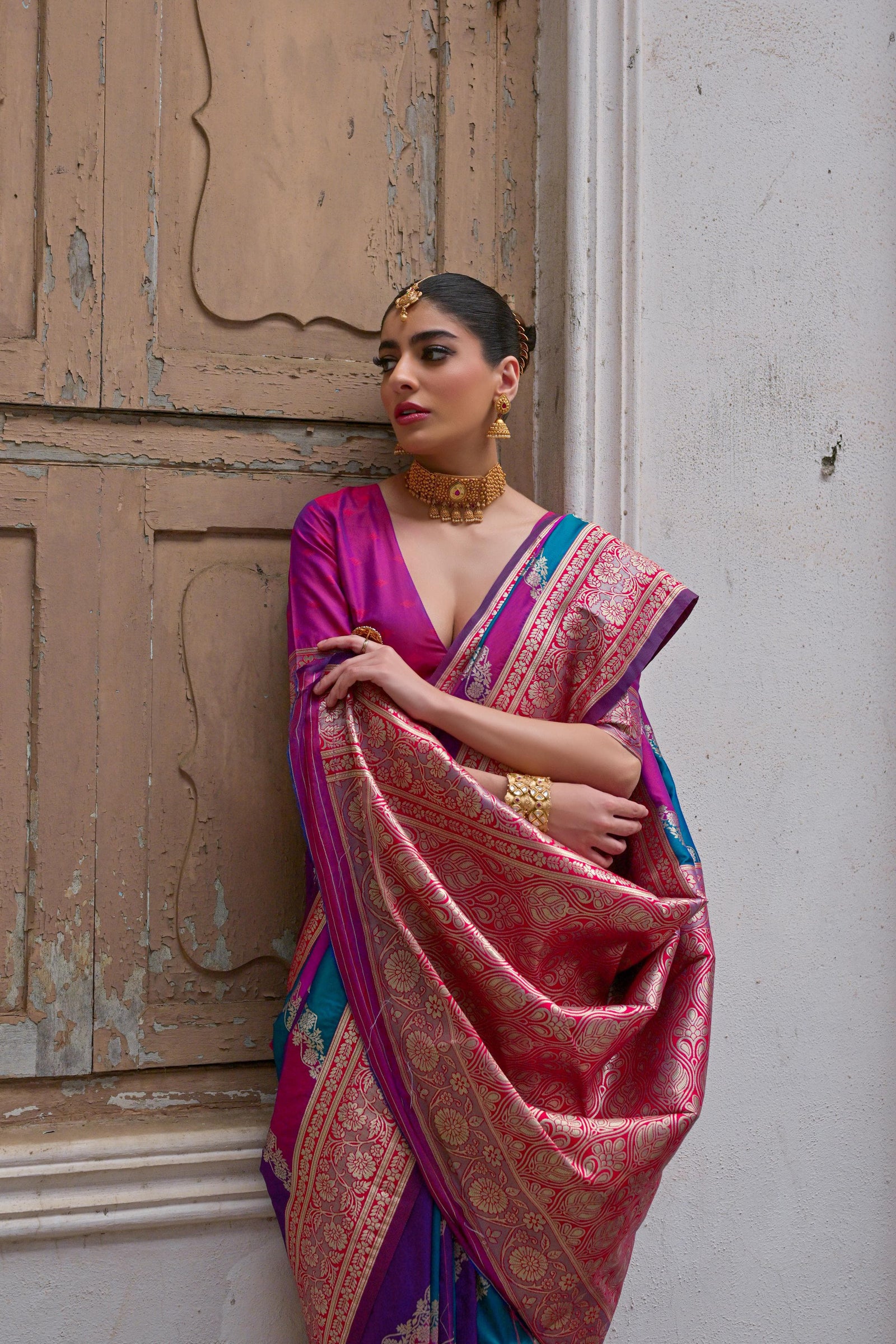 Close up of pink saree with intricate Kadwa style weaving