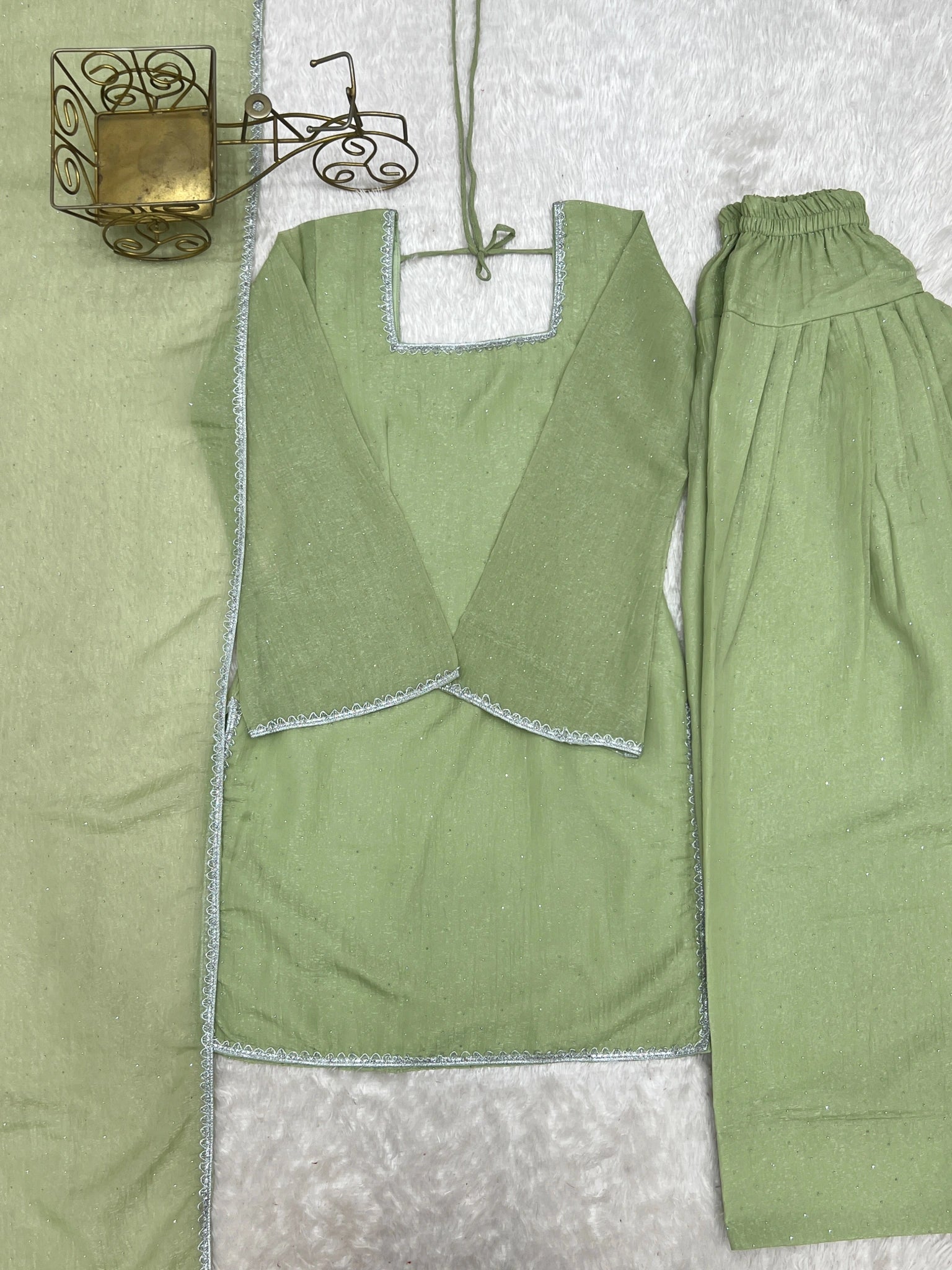 Pista green suit flat lay - kurta, shalwar and dupatta