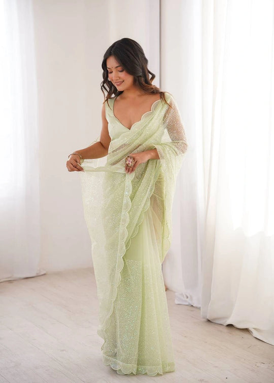 Pista sequins embroidered thread work soft net saree – front drape on model
