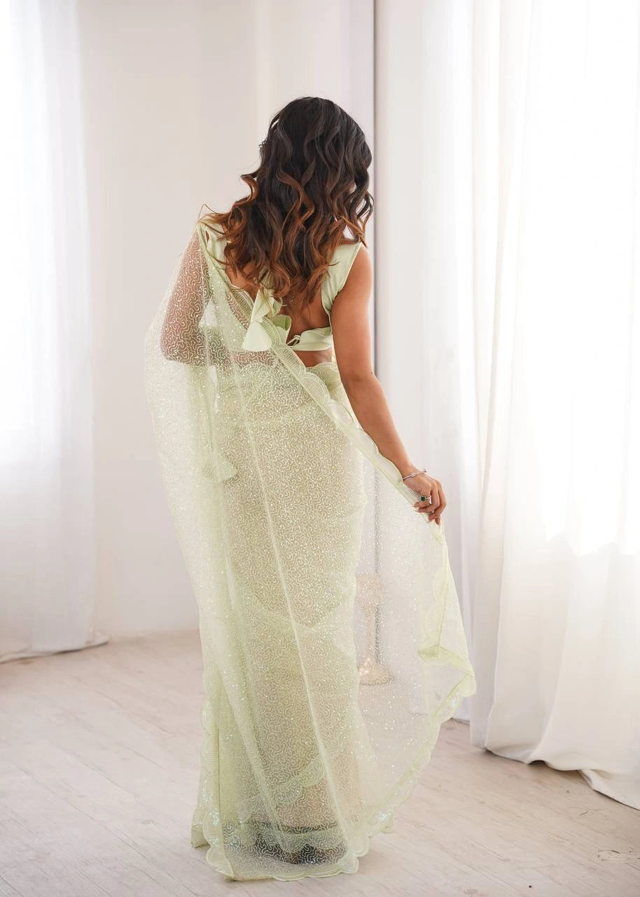 Pista sequins saree – back view on model