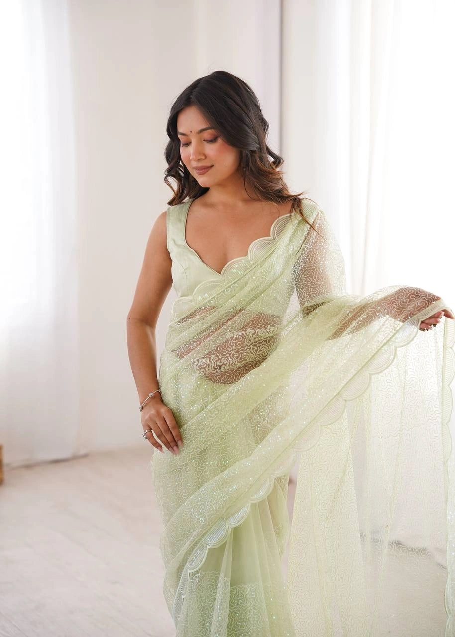 Pista party wear sequins saree – pleats and pallu on model