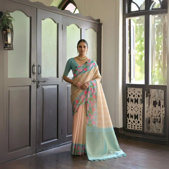 Powder blue saree featuring intricate zari work design