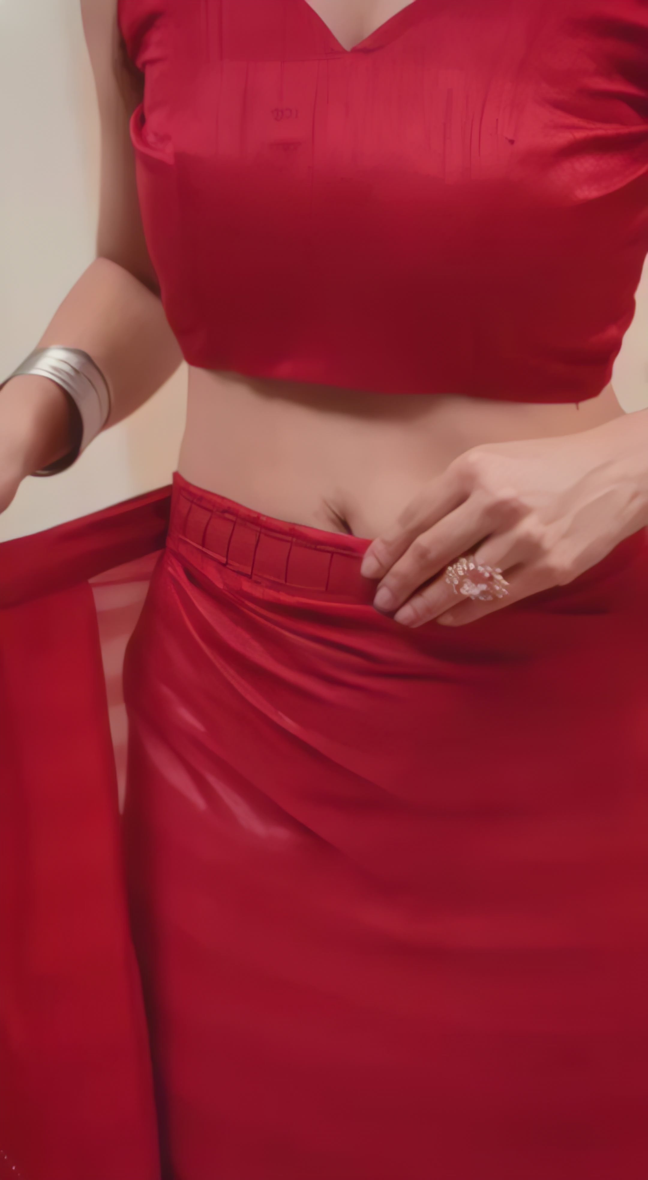 A woman models a vibrant Dark Pink Rimzim Silk Saree. The sheer fabric features prominent vertical stripes of fine metallic (silver) threadwork and subtle dot embellishments. She wears a matching sleeveless pink V-neck blouse and accessorizes with chunky oxidized silver jewelry, including a layered necklace and thick bangles.