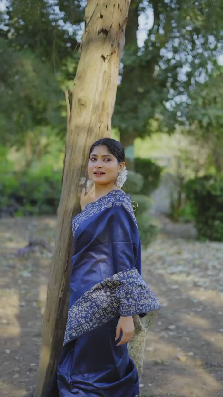 Navy blue saree with intricate Gala Border pattern closeup in forest