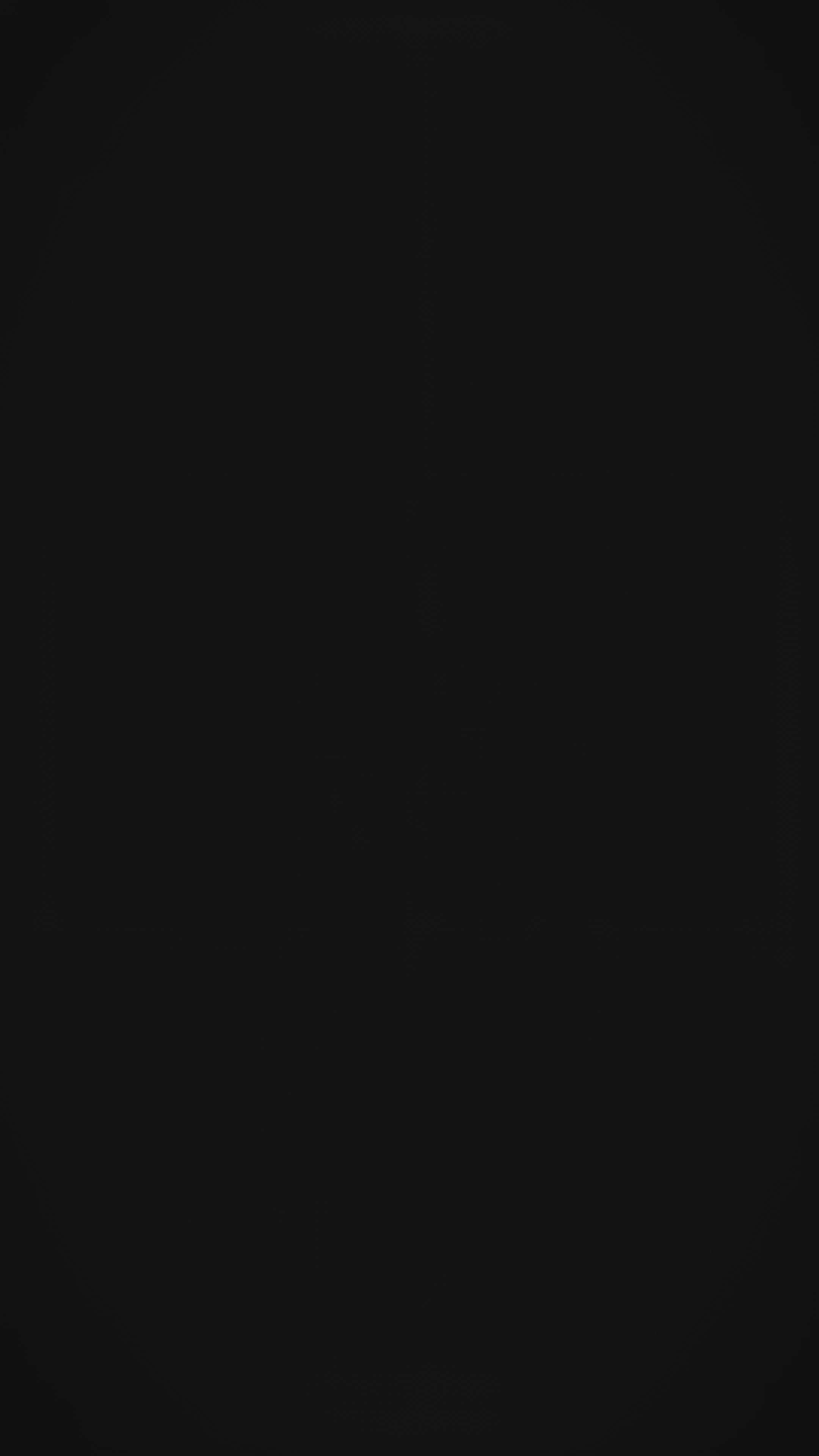 A woman models a Soft Tussar Silk Saree in dusty purple, covered in an elaborate all-over artistic print. The pallu features dense Zari weaving with a striped pattern. She wears a purple blouse and a substantial set of oxidized silver jewelry, posing against a large tree.