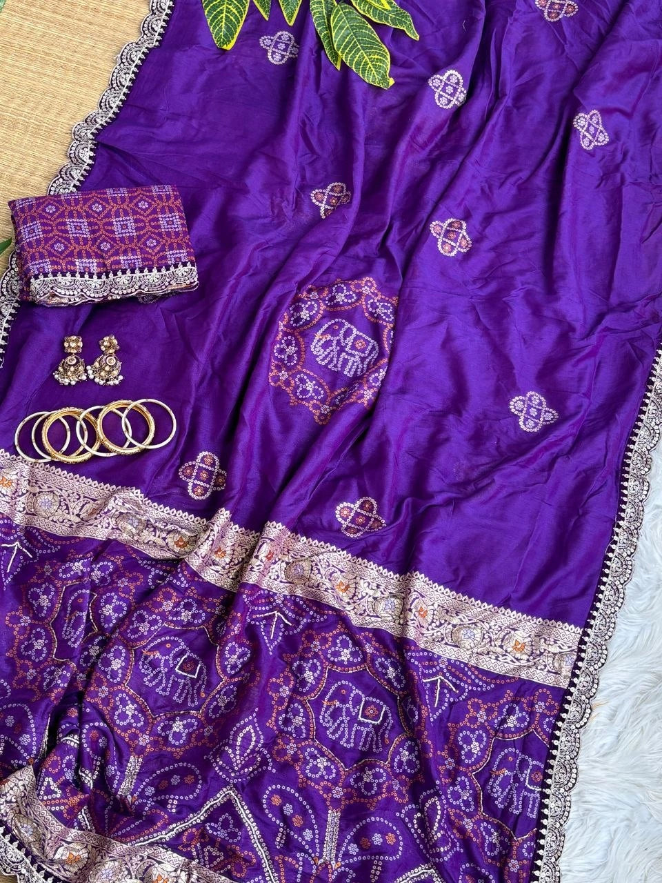 Purple bandhani print saree folded with lace blouse piece and bangles – Kalyanja KS408