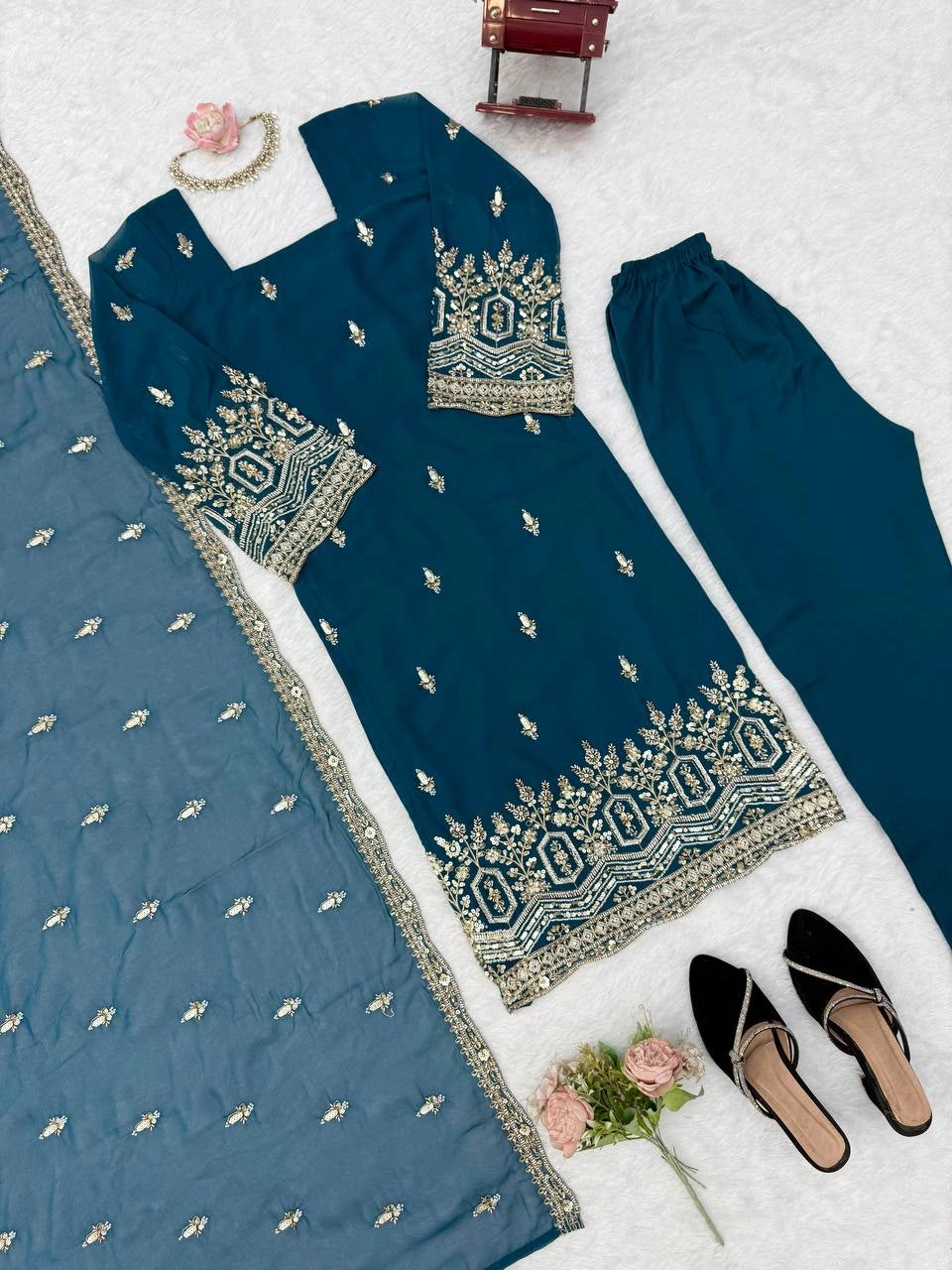 Rama Blue suit flat lay close up showing hem border detail and pant