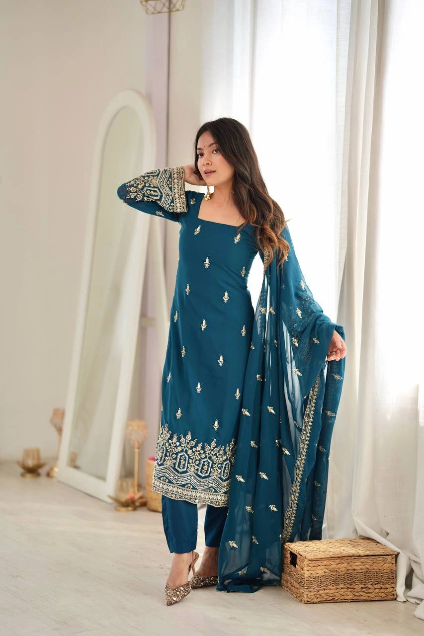 Rama Blue suit three quarter view model showing square neckline and cuff work