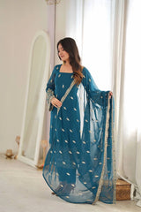 Rama Blue Faux Georgette suit model spreading sheer dupatta showing full length
