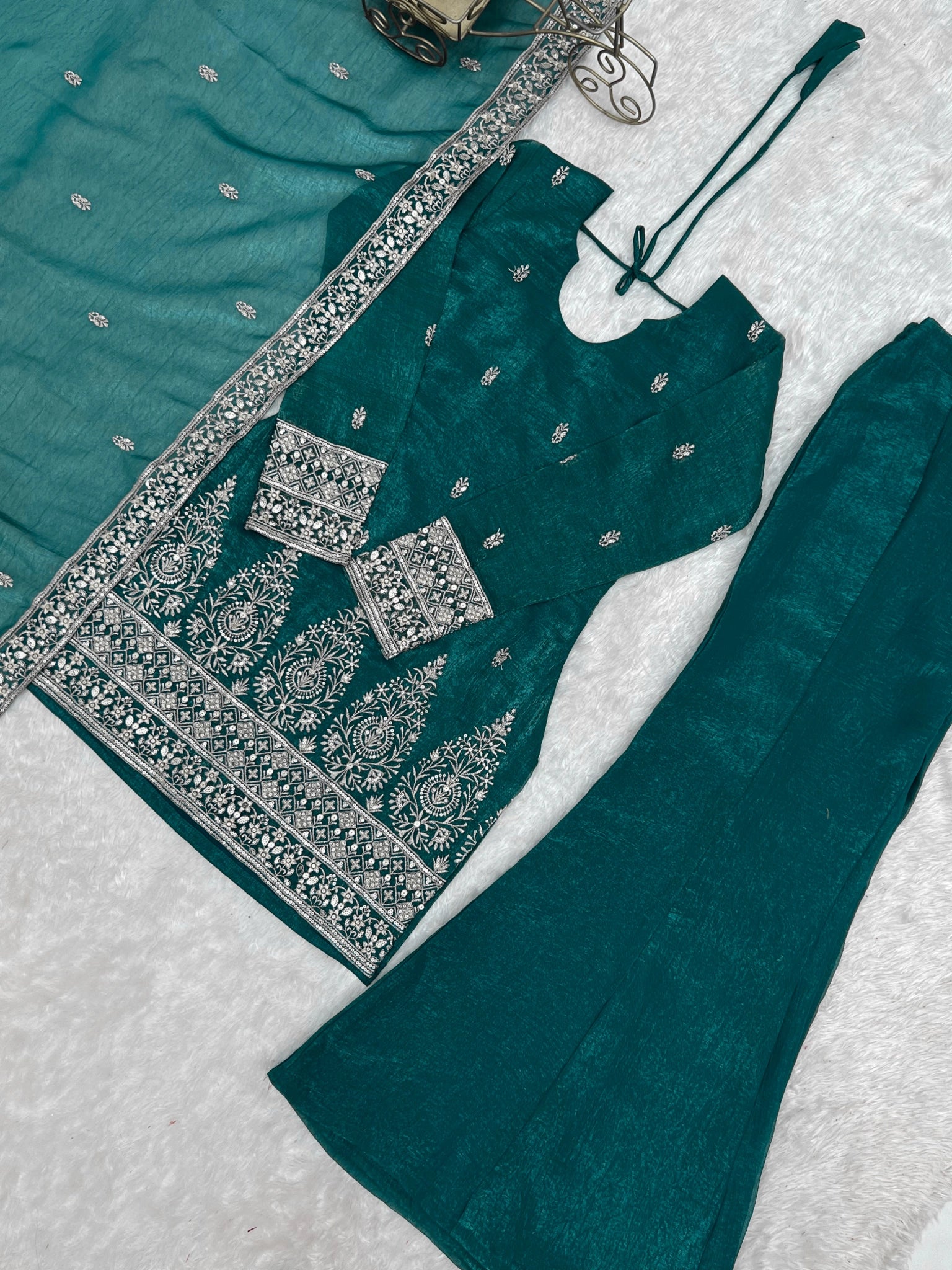 Rama suit flat lay - hem embroidery detail