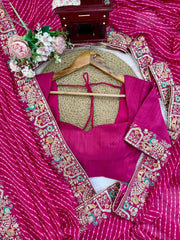Rani pink saree border and blouse piece flat lay