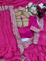 Rani pink saree embroidered pallu – flat lay