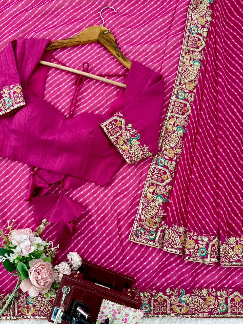 Rani pink leheriya saree with hanger blouse – flat lay