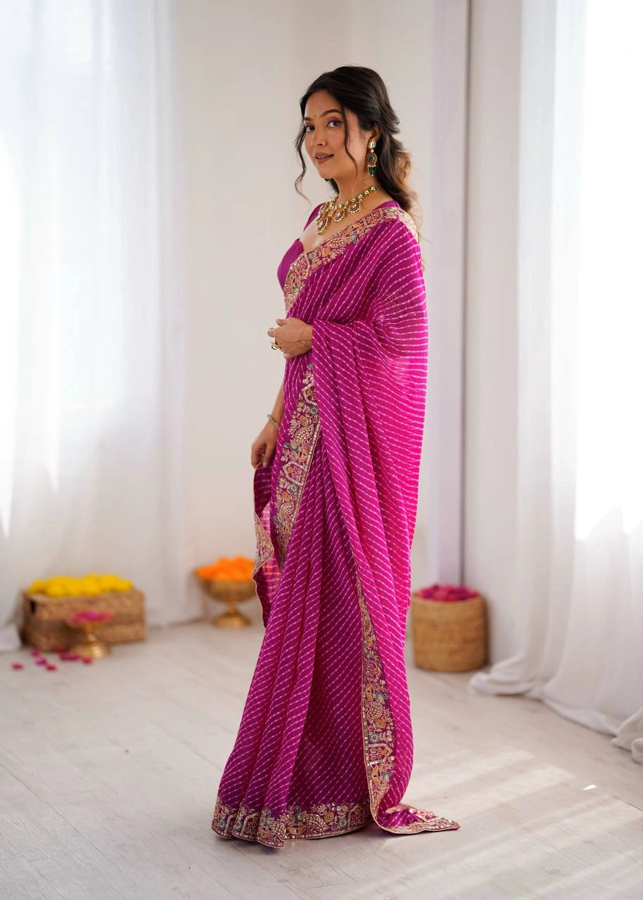 Rani pink leheriya saree with embroidered border – model pose