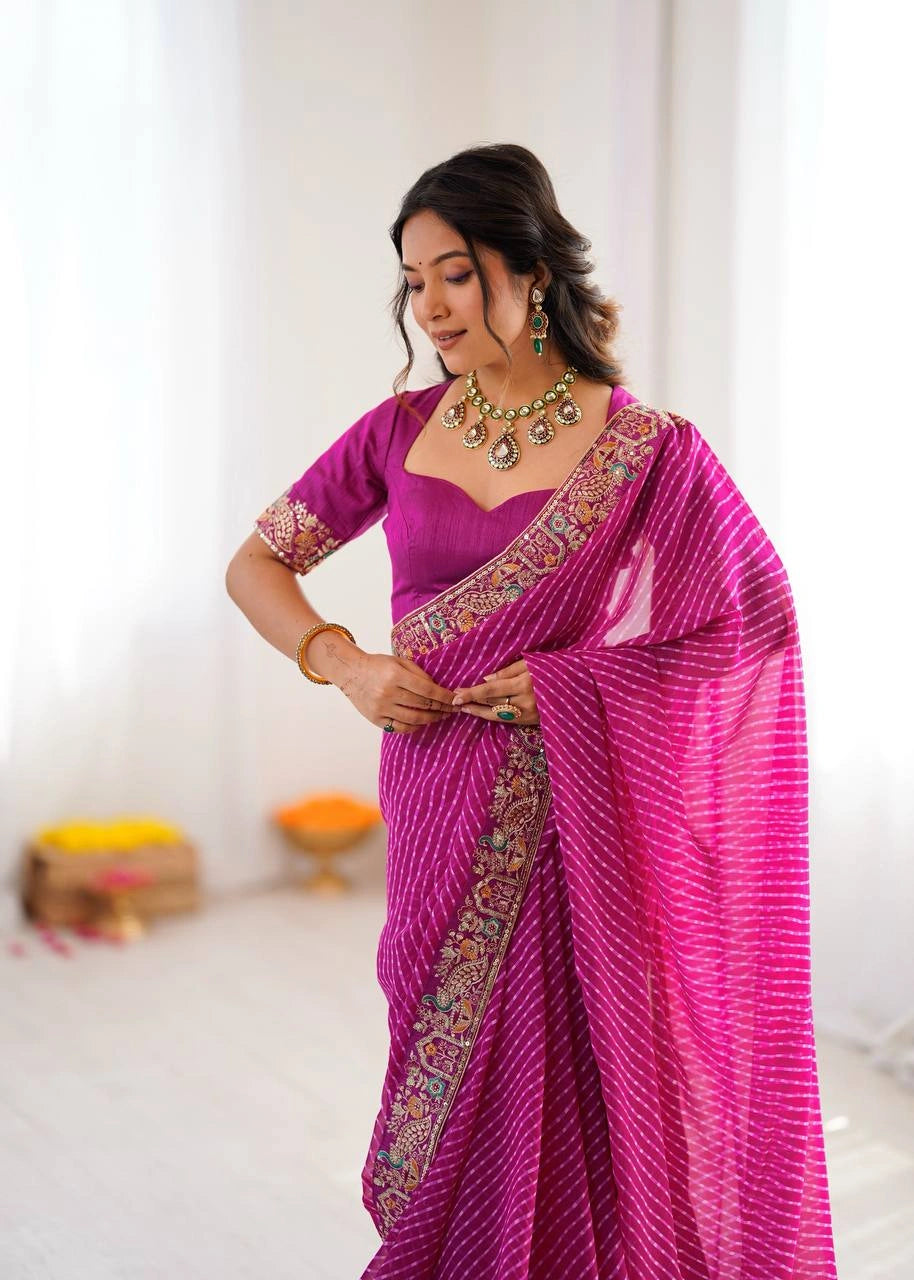 Rani pink wedding wear saree – embroidered pallu on model
