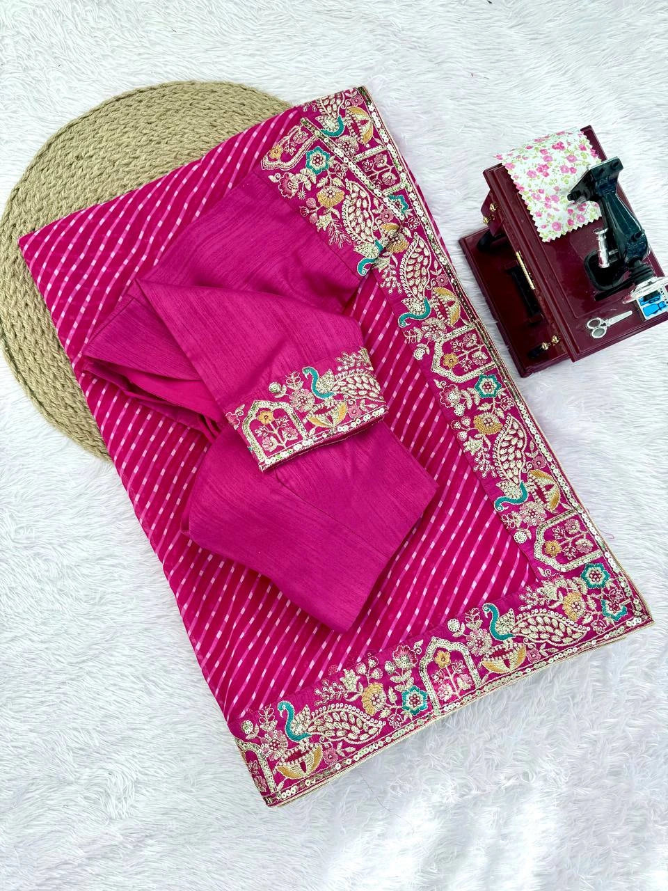 Rani pink faux georgette saree with blouse piece – flat lay