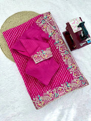 Rani pink faux georgette saree with blouse piece – flat lay