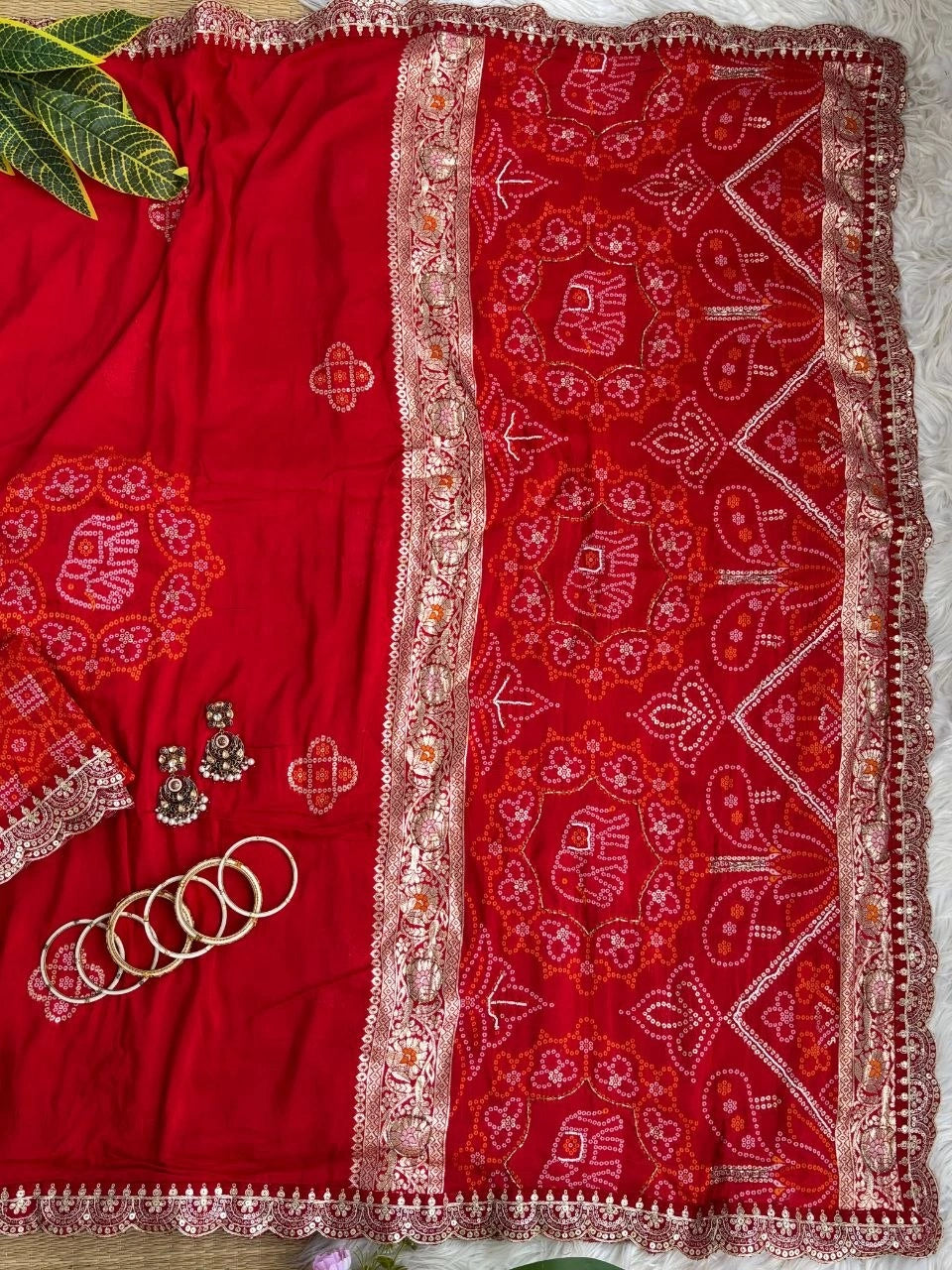 Red viscose georgette saree with elephant bandhani motifs and lace border – Kalyanja KS408