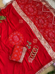 Red bandhani print saree folded with lace blouse piece and bangles – Kalyanja KS408