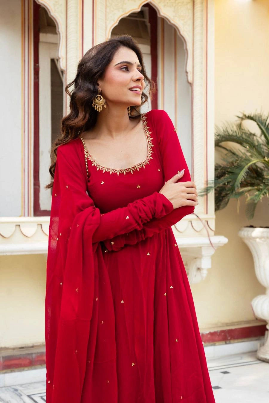 Red Anarkali Suit close up portrait showing round neckline leaf embroidery trim detail