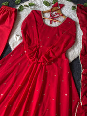 Red Anarkali Suit flat lay close-up showing embroidered butti motifs and lace dupatta border