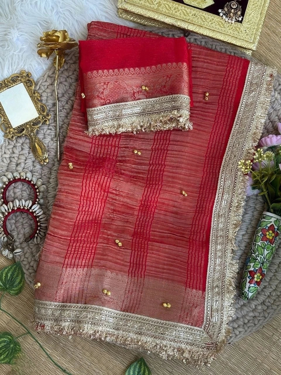Red saree folded with lace blouse piece styled flat lay – Kalyanja KS406