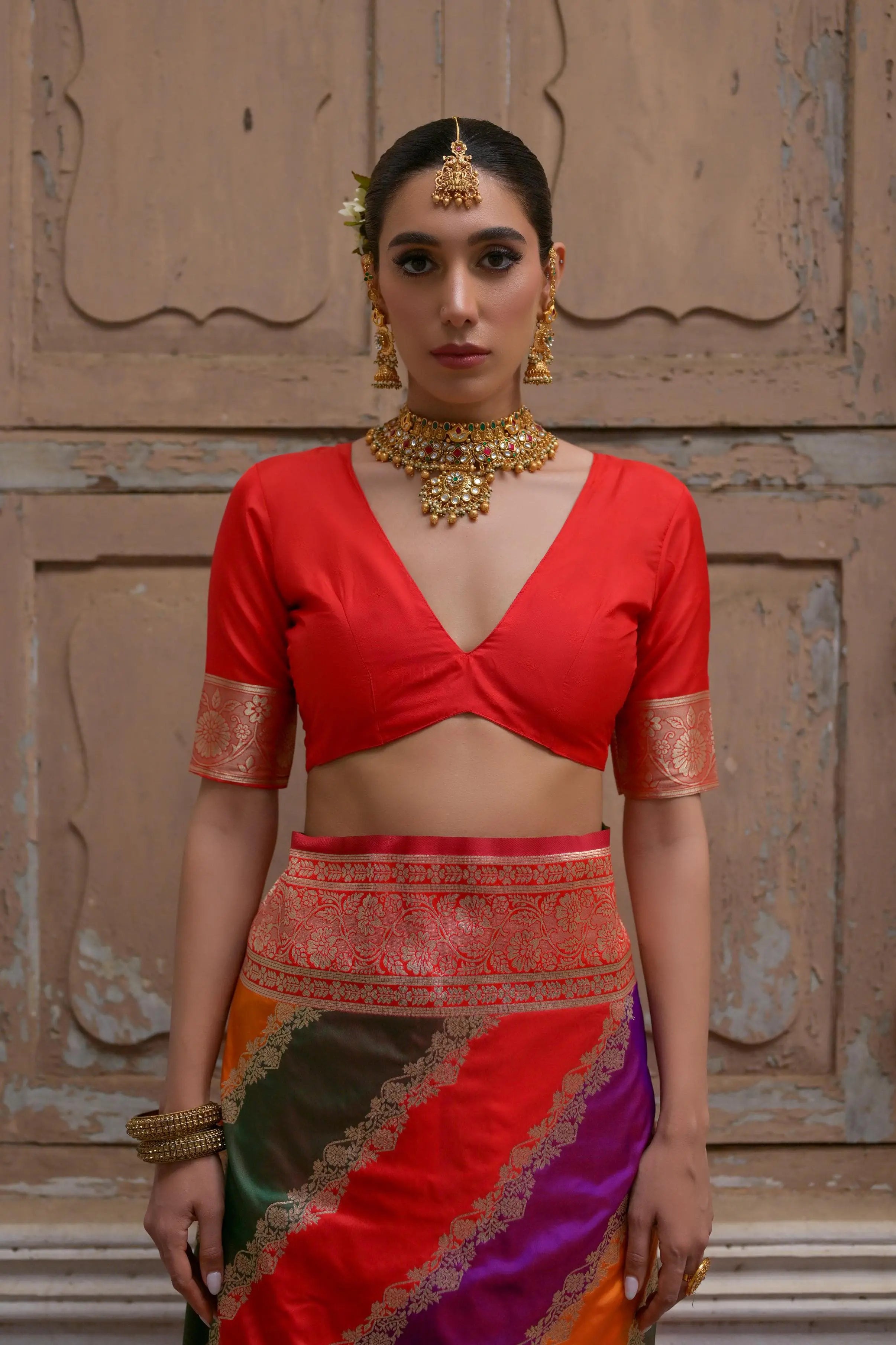 Close up of red saree with intricate Kadwa style weaving