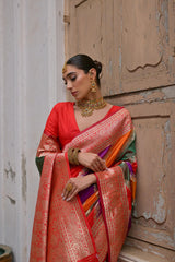Close up of red saree with Kadwa style weaving and multicolor design